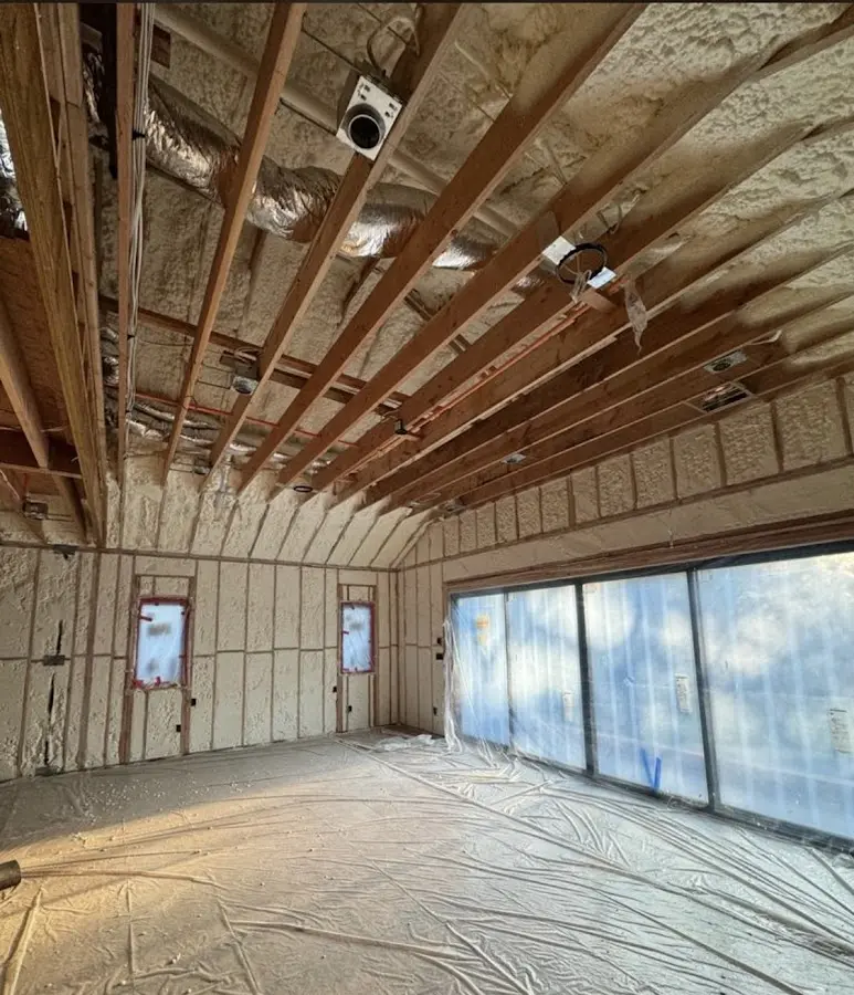 Interior walls and ceiling insulated with spray foam during new construction in Fairfield Plantation